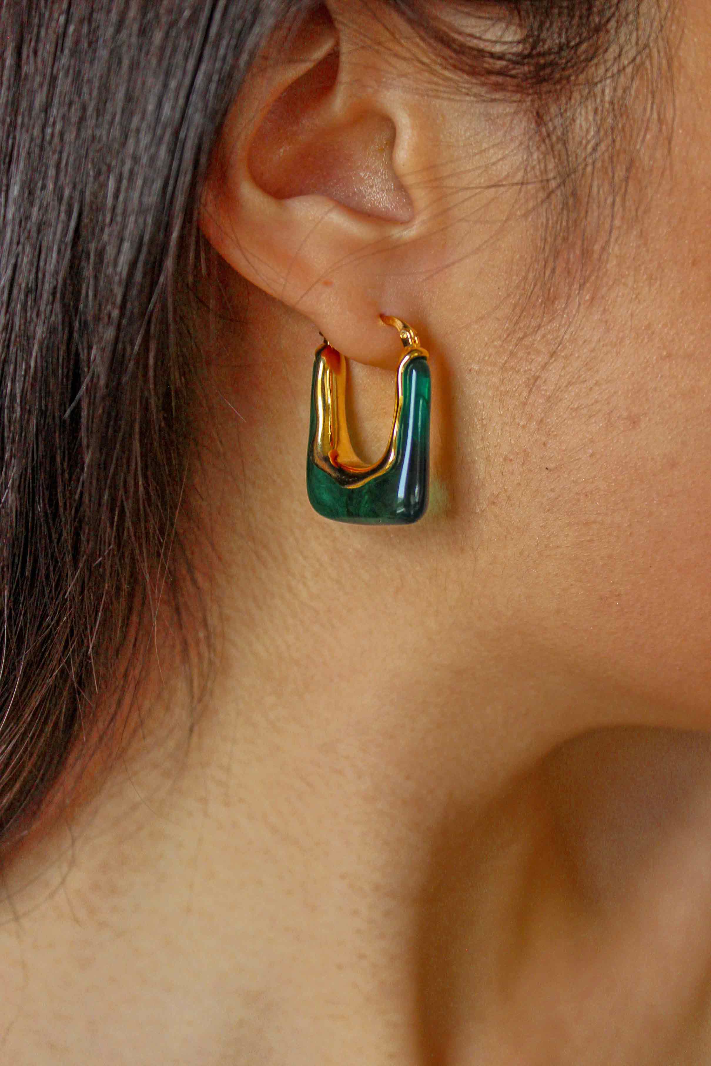 green resin earrings when worn