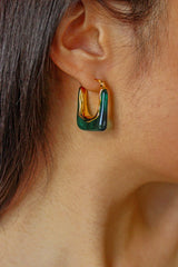 green resin earrings when worn