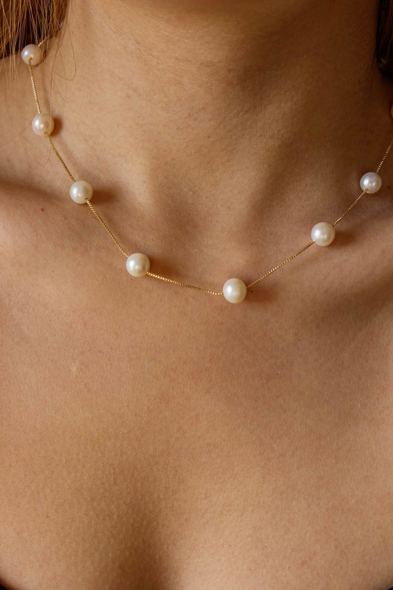 pearl choker when worn